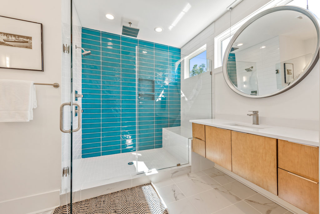 modern bathroom with walk in shower and shower bench